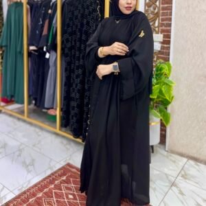 Woman in elegant black attire.